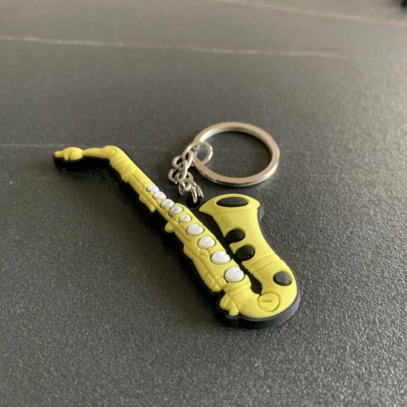 Chaveiro de instrumentos musicais em miniatura, de silicone, diversos modelos