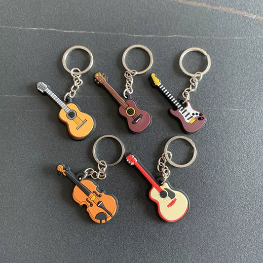 Chaveiro de instrumentos musicais em miniatura, de silicone, diversos modelos