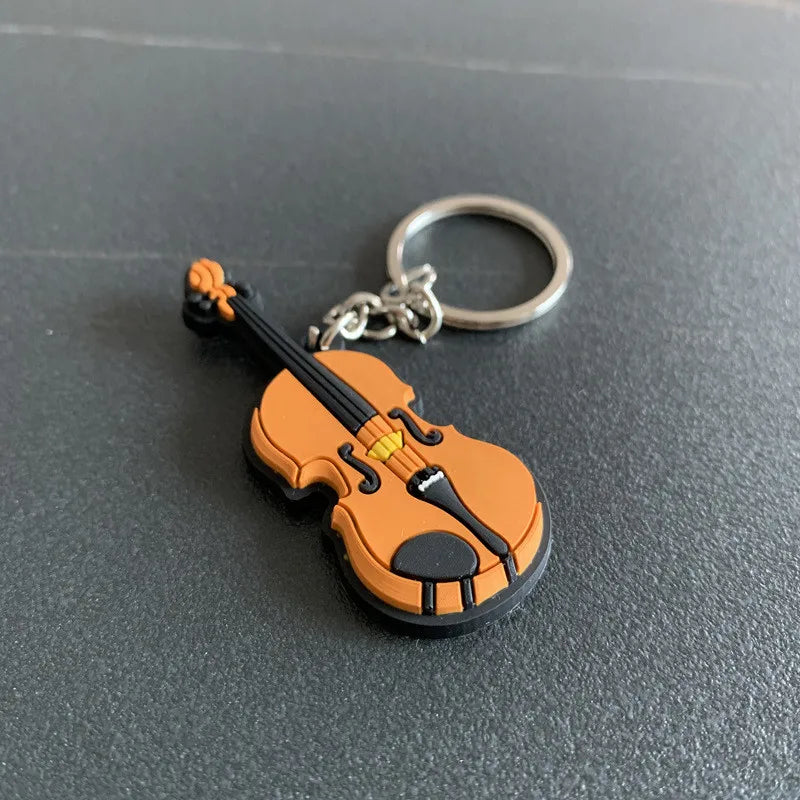 Chaveiro de instrumentos musicais em miniatura, de silicone, diversos modelos